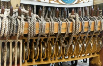 A lot of the rigging terminated in tiebacks like this. You can see the pulleys are in regular use due to their polished surfaces.