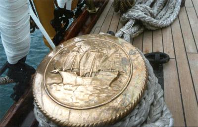 A stanchion cover with the ship represented on it.